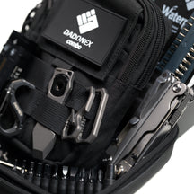Close-up of the loaded OMNI Field pouch inside the open carrying case