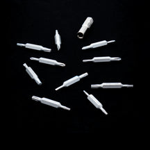 Silver VERTEX Prism double-ended bits and adapter arranged on a black background